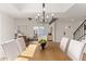 Bright dining room features a wooden table, chandelier, and access to the living room at 6309 N 14Th St, Phoenix, AZ 85014