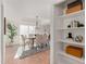 Open concept dining area with built-in shelving and view into adjacent living area at 6309 N 14Th St, Phoenix, AZ 85014