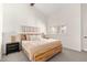 Bright and airy main bedroom, featuring a wood platform bed and ample natural light at 6309 N 14Th St, Phoenix, AZ 85014