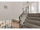 Elegant staircase with wrought iron railing leading to upper level at 6309 N 14Th St, Phoenix, AZ 85014