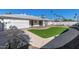 View of the home's back and putting green at 7513 E Minnezona Ave, Scottsdale, AZ 85251