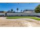 Backyard with putting green and partial view of a building at 7513 E Minnezona Ave, Scottsdale, AZ 85251