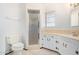 Clean bathroom with updated vanity, shower, and toilet at 7513 E Minnezona Ave, Scottsdale, AZ 85251