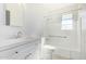 Bathroom with white vanity, shower/tub combo, and tile flooring at 7513 E Minnezona Ave, Scottsdale, AZ 85251