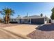 Newly renovated mid-century home with a large driveway and two-car garage at 7513 E Minnezona Ave, Scottsdale, AZ 85251