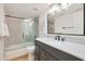 Bathroom with dark vanity and walk-in shower at 7730 E Buena Terra Way, Scottsdale, AZ 85250