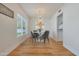 Bright dining room with four chairs and a modern chandelier at 7730 E Buena Terra Way, Scottsdale, AZ 85250