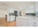 Modern kitchen with white cabinets, quartz countertops and island at 7730 E Buena Terra Way, Scottsdale, AZ 85250