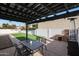 Covered patio with table, chairs, and heater at 7730 E Buena Terra Way, Scottsdale, AZ 85250