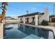 Long pool with patio and string lights at 7730 E Buena Terra Way, Scottsdale, AZ 85250