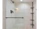 Clean shower with glass enclosure and shelving at 7730 E Buena Terra Way, Scottsdale, AZ 85250