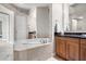 Bathroom with large soaking tub and separate shower at 8 Biltmore Est # 123, Phoenix, AZ 85016