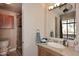 Elegant bathroom with updated vanity and glass-enclosed shower at 8 Biltmore Est # 123, Phoenix, AZ 85016