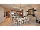 Elegant dining room with a large table and access to the kitchen at 8 Biltmore Est # 123, Phoenix, AZ 85016