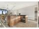 Kitchen island with wine cooler and granite countertop at 8 Biltmore Est # 123, Phoenix, AZ 85016