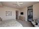 Main bedroom with king bed, sitting area, and access to the bathroom at 8 Biltmore Est # 123, Phoenix, AZ 85016