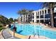 Resort-style pool area with building in background at 8 Biltmore Est # 123, Phoenix, AZ 85016