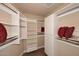 Large walk-in closet with ample shelving and hanging space at 8 Biltmore Est # 123, Phoenix, AZ 85016