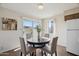 Dining area with round table and chairs near sliding glass door at 8131 N 107Th Ave # 81, Peoria, AZ 85345