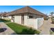 Exterior view of a light-colored condo with brown roof and walkway at 8131 N 107Th Ave # 81, Peoria, AZ 85345