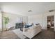 Living room with beige couch, armchairs, and a coffee table at 8131 N 107Th Ave # 81, Peoria, AZ 85345