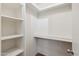 White storage room with shelves for additional storage at 8131 N 107Th Ave # 81, Peoria, AZ 85345