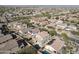 Aerial view showing a house with a pool and solar panels in a neighborhood at 9017 W Pinnacle Vista Dr, Peoria, AZ 85383