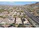 Aerial view of a house in a residential neighborhood with a pool and solar panels at 9017 W Pinnacle Vista Dr, Peoria, AZ 85383