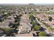 Aerial view of a residential neighborhood with a house featuring a pool and solar panels at 9017 W Pinnacle Vista Dr, Peoria, AZ 85383