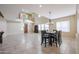 Spacious dining area with tile floors and a view into the living room at 9017 W Pinnacle Vista Dr, Peoria, AZ 85383