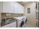 Convenient laundry room with washer, dryer, and sink at 9017 W Pinnacle Vista Dr, Peoria, AZ 85383