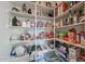 Well-stocked pantry with ample shelving for food storage at 9017 W Pinnacle Vista Dr, Peoria, AZ 85383