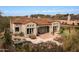 Stunning aerial view of the home with pool and putting green at 9111 E Mountain Spring Rd, Scottsdale, AZ 85255