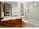 Elegant bathroom with a soaking tub, tiled shower, and wood vanity at 9111 E Mountain Spring Rd, Scottsdale, AZ 85255