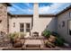 Relaxing courtyard with seating area and fireplace at 9111 E Mountain Spring Rd, Scottsdale, AZ 85255