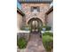 Charming entryway with stone details and arched doorway at 9111 E Mountain Spring Rd, Scottsdale, AZ 85255