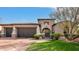 Elegant home with stone accents and a two-car garage at 9111 E Mountain Spring Rd, Scottsdale, AZ 85255