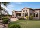 Beautiful home exterior with a putting green and patio at 9111 E Mountain Spring Rd, Scottsdale, AZ 85255