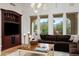 Bright living room with hardwood floors, a large sectional sofa and mountain views at 9111 E Mountain Spring Rd, Scottsdale, AZ 85255