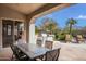 Outdoor patio with seating, built-in grill, and mountain views at 9111 E Mountain Spring Rd, Scottsdale, AZ 85255