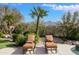 Relaxing poolside view with lounge chairs and mountain backdrop at 9111 E Mountain Spring Rd, Scottsdale, AZ 85255