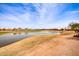 Aerial view of homes and a lakefront golf course at 9312 E Arrowvale Dr, Sun Lakes, AZ 85248