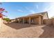 Spacious backyard with covered patio and gravel landscaping at 9312 E Arrowvale Dr, Sun Lakes, AZ 85248