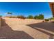 Small backyard with gravel and a tan block wall at 9312 E Arrowvale Dr, Sun Lakes, AZ 85248