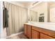 Well-lit bathroom with double sinks and shower/tub combo at 9312 E Arrowvale Dr, Sun Lakes, AZ 85248