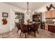 Charming breakfast nook with round table and wicker chairs at 9312 E Arrowvale Dr, Sun Lakes, AZ 85248