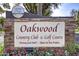 Oakwood Country Club & Golf Course entrance sign at 9312 E Arrowvale Dr, Sun Lakes, AZ 85248