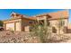 Single-story home with two-car garage and desert landscaping at 9312 E Arrowvale Dr, Sun Lakes, AZ 85248