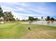 Golf course with lake and fountain feature at 9312 E Arrowvale Dr, Sun Lakes, AZ 85248