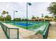 Two tennis courts and seating area at 9312 E Arrowvale Dr, Sun Lakes, AZ 85248